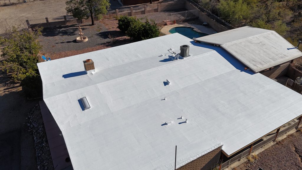 Elastomeric roof coating for winter applied to a Tucson home to improve protection and energy efficiency.